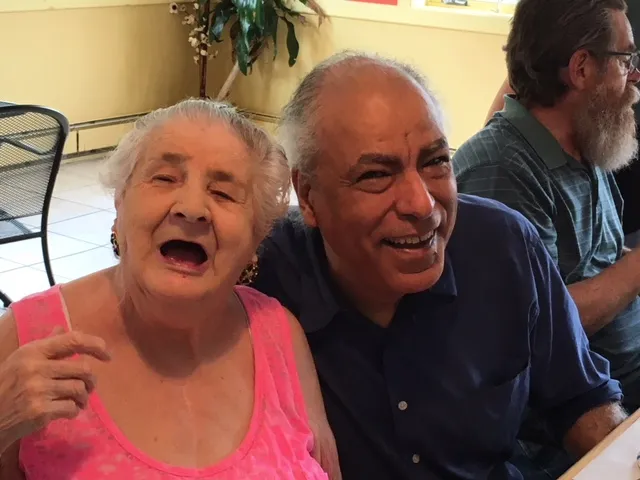 A Volunteer visiting with a Senior