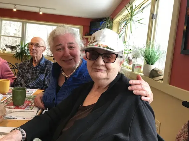 A Volunteer and a Senior at a Catskill Neighbors Luncheon.