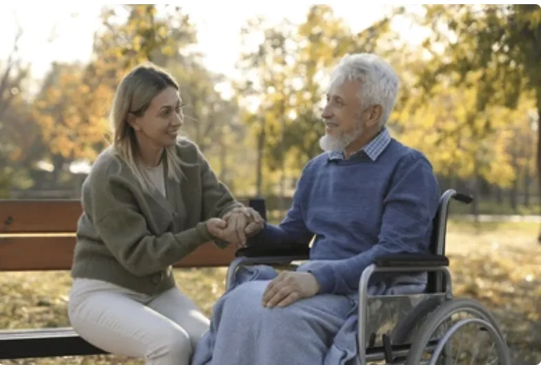A Volunteer visiting with a Senior.